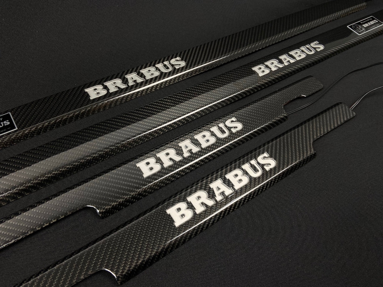 Brabus Door Sills Carbon Red LEDs for Mercedes-Benz G-Class W463, premium carbon fiber finish with illuminated LED logo