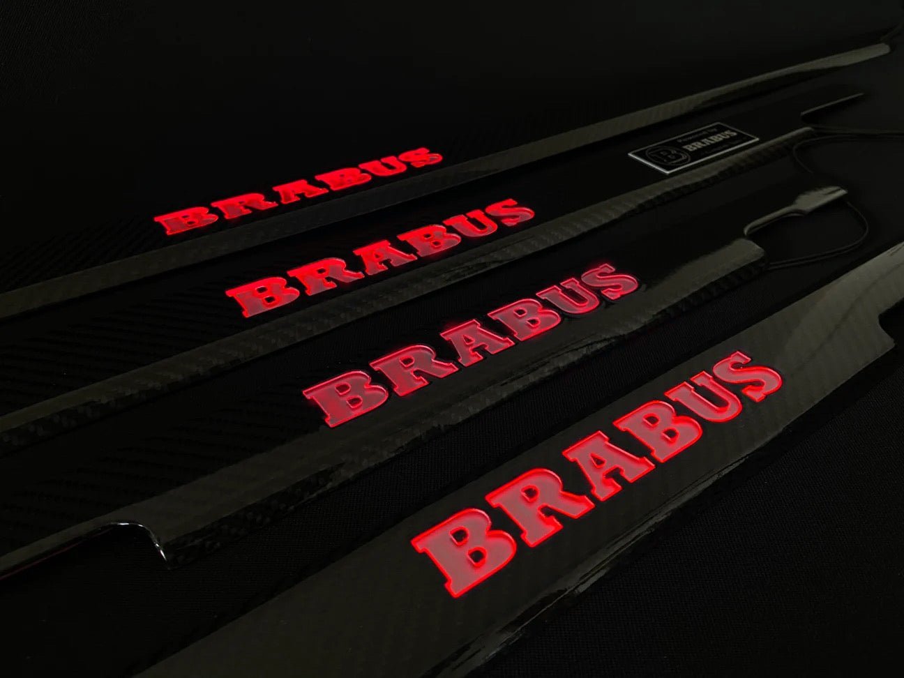 Brabus Door Sills Carbon Red LEDs for Mercedes-Benz G-Class W463, premium carbon fiber finish with illuminated LED logo