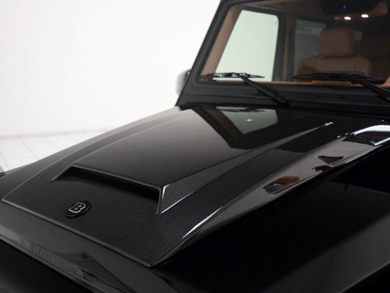 Brabus hood scoop fiberglass cover with badge for Mercedes W463 G-Wagon from Custom Class, featuring bold and luxurious Brabus-inspired styling.