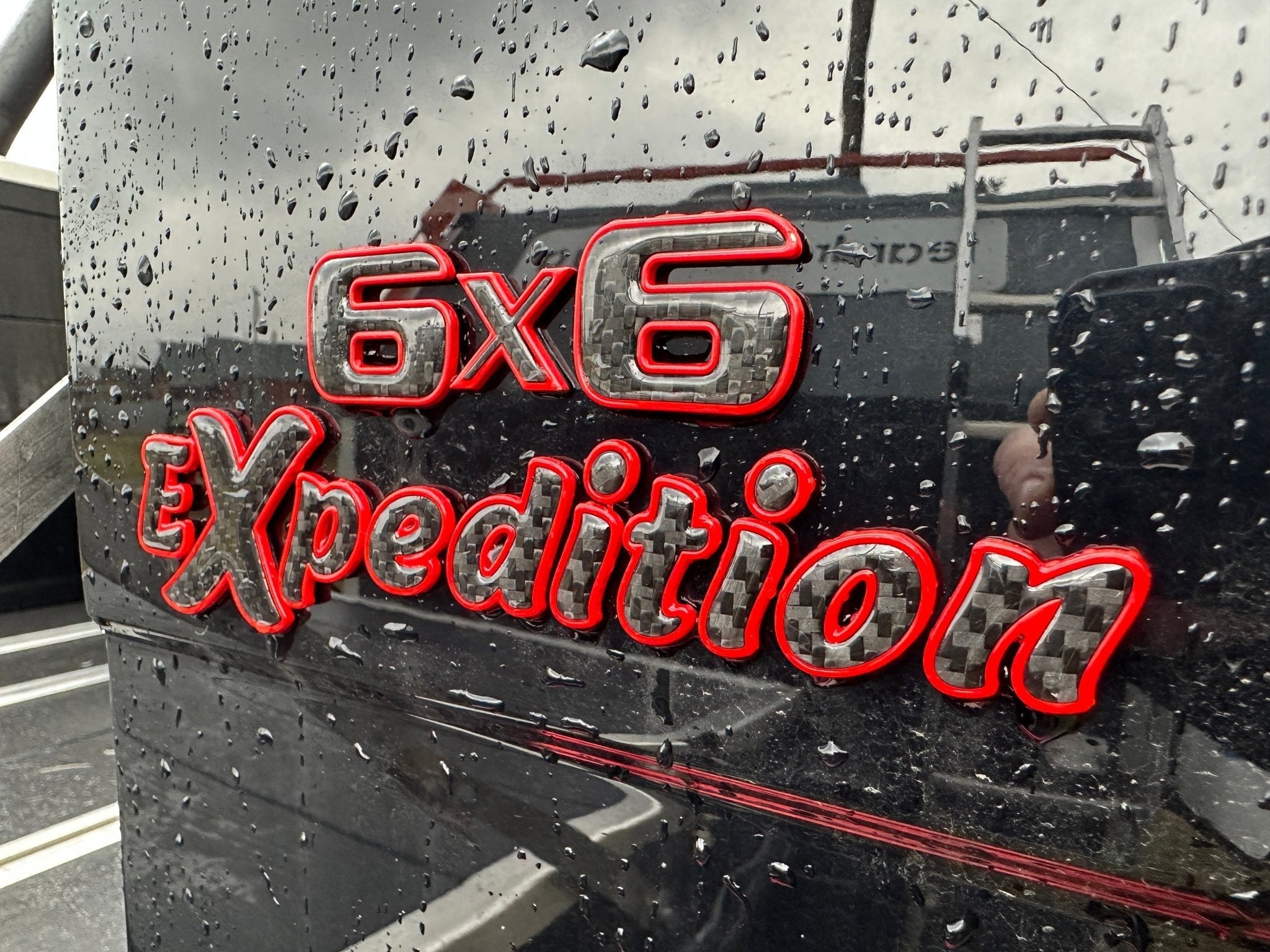 6x6 Expedition Emblem Logo 2-Component Red Metal with Carbon for Mercedes W463 6x6 from Custom Class, high-quality metal and carbon construction.