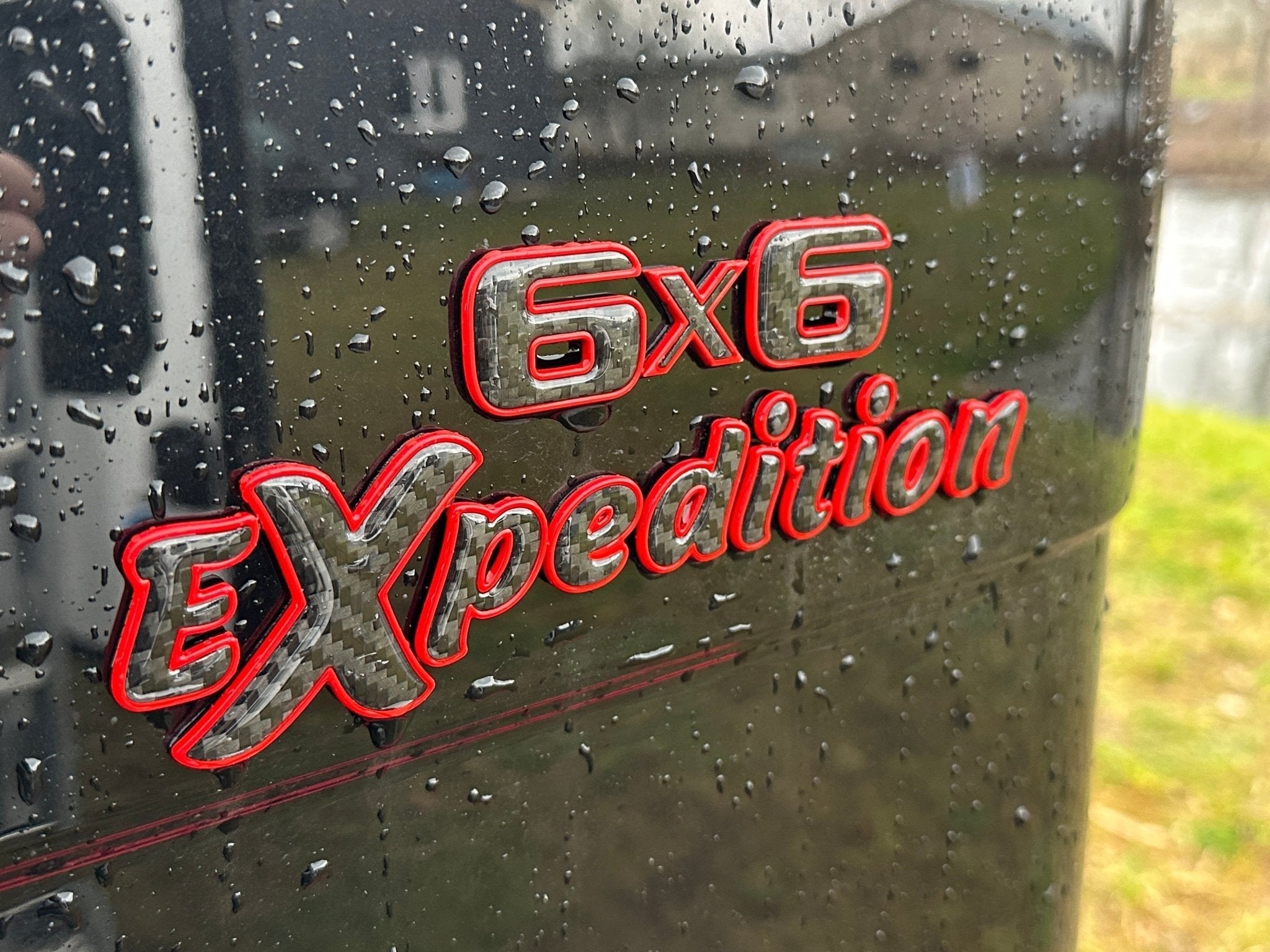 6x6 Expedition Emblem Logo 2-Component Red Metal with Carbon for Mercedes W463 6x6 from Custom Class, high-quality metal and carbon construction.