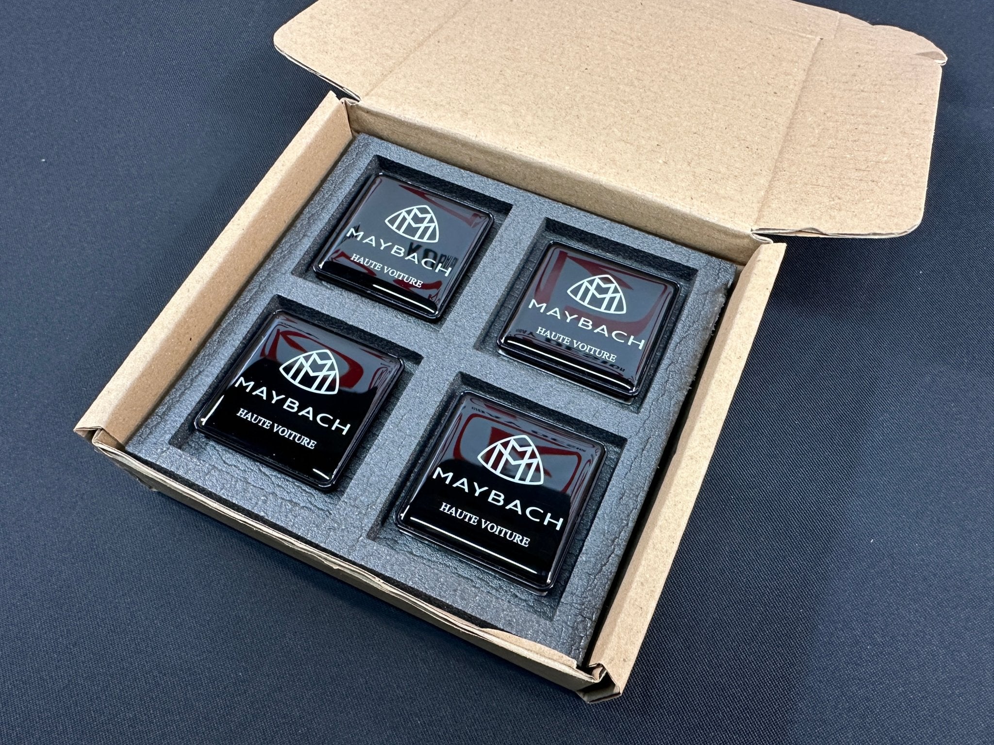 Seats Emblem set in black color with Maybach Haute Voiture logo for Mercedes-Benz - Custom Class
