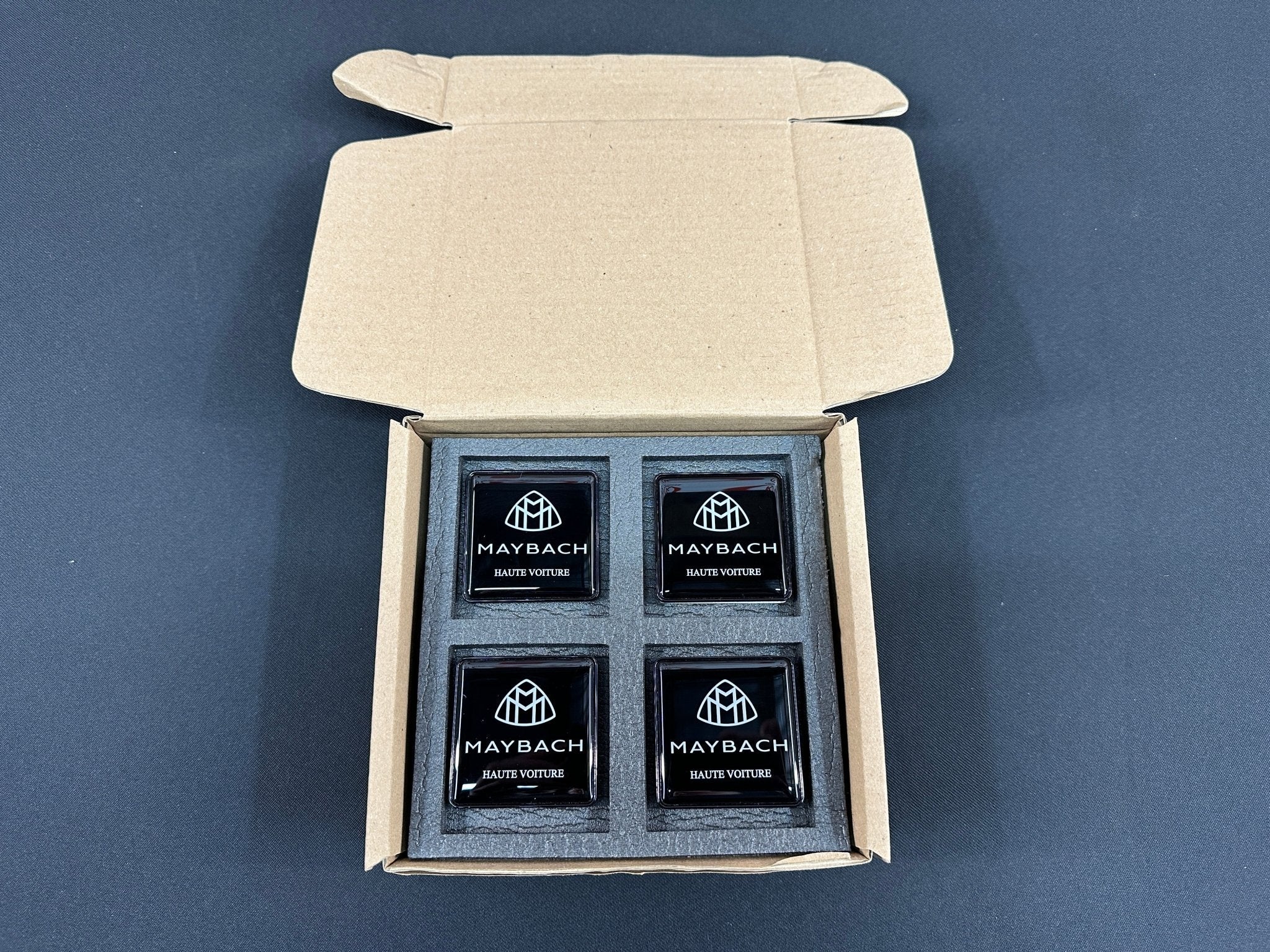 Seats Emblem set in black color with Maybach Haute Voiture logo for Mercedes-Benz - Custom Class